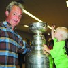 Darryl Sutter all smiles showing Stanley Cup to friends and family in Viking